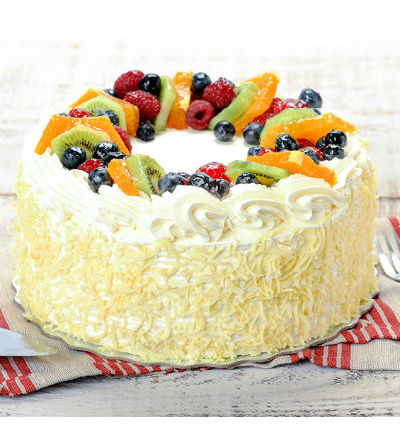 Fruit cake with kiwi, peach, strawberry topping, 1 lb (1/2 kg). (substitutions may apply if item not available)
