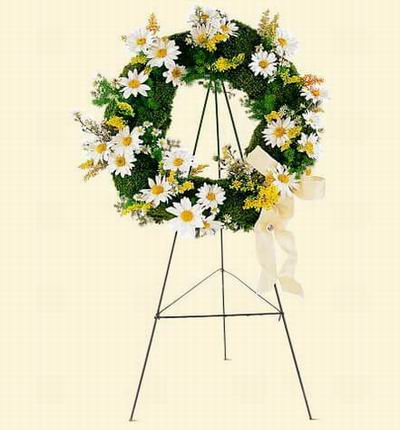 Wreath Shaped Stand with white Daisies and Greenery.