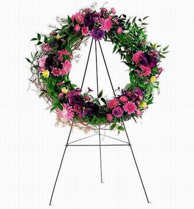 Wreath Shaped Stand with Roses, Carnations, Chysanthemums and Greenery.