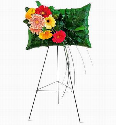 Pillow Shaped Stand made of leaves with Gerbera Daisies and Chysanthemums