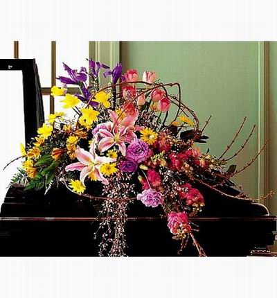 Arrangement of Lilies, Eustomas, Tulips, Iris, Daisies and fillers.