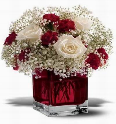 Romantic flowers in a lovered cube vase.
