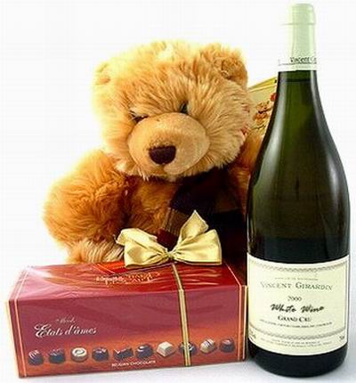 White Wine, Assorted Chocolates, and a 20 cm Teddy Bear. Wine based on local wine selection. Brands will vary.  (Photo image is only an example)