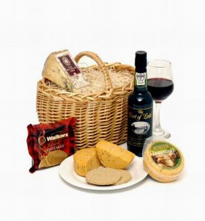 Picnic red wine, biscuts and cheese basket.