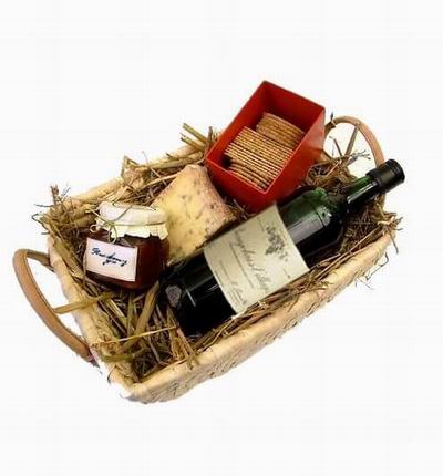 Bottle of red wine,Strawberry jam, Cheese and crackers. Wine based on local wine selection. Brands will vary.  (Photo image is only an example)
