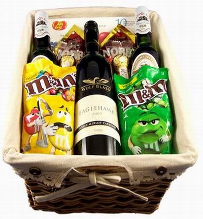 1 bottle of red wine, two bottles of beer, two packs of M&Ms, two packs of 3pc Ferrero Chocolates, and Jelly Belly candies. (Substitution may apply if an item is not available).