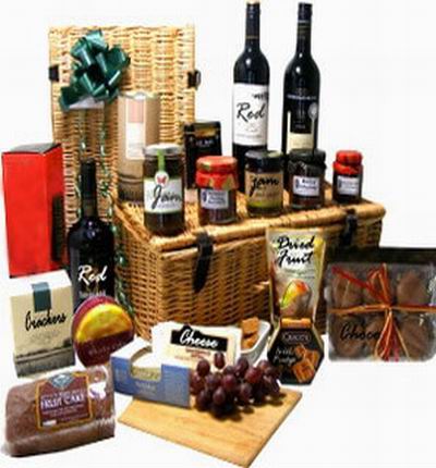 3 bottles of red wine, Cheese, Crackers, 5 assorted Fruit Jams, Fruit Cake, Dried fruit pack, Cookies and Chocolates.