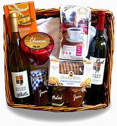 1 bottle of red wine and 1 bottle of white wine, strawberry jam, orange jam, mustard, Cheese, Chocolate biscuts, cookies, and coffee beans. Wine based on local wine selection. Brands will vary.  (Photo image is only an example)