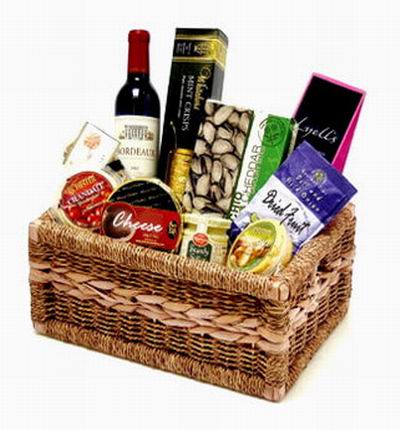 1 Bottle of red wine, Cranberry candy drops, Mustard, Cheese, Pistachios, Mint chocolate crisps and dried fruits. Wine based on local wine selection. Brands will vary.  (Photo image is only an example)