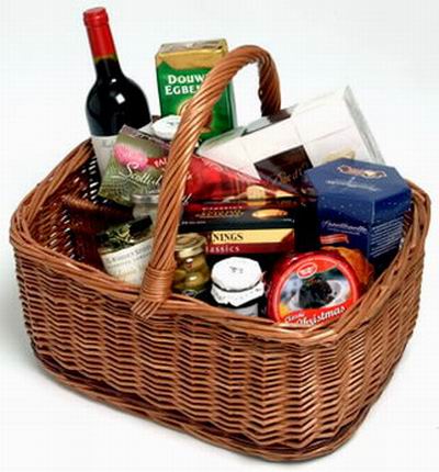 Basket of red wine, Cookies, Olives, grape Jam, Cheese, Mustard and biscuts.