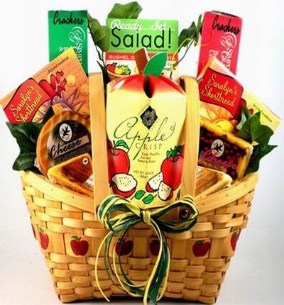 Basket of healthy Apple Crisps, two packages of shortbread, two types of cheese, two boxes of crackers and a Ready Salad set mix.  If the salad mix is not available, it will be substituted with more crackers.