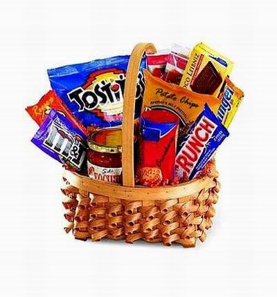Basket of serious snacks. Doritos chips, Crunch chocolate bar, Butterfinger bar, packaged Chocolate cake roll, Crackers with cheese (Ritz), Salsa Sauce for the Chips, 2 bags of candy snacks, M&Ms, Reese's candy and Potato Chips.  A total of 11 snacks!