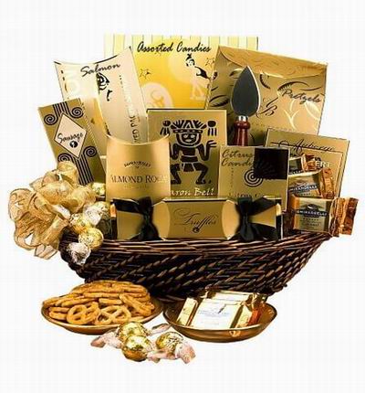 Golden theme basket with Almond Rock Candy, Chocolate Truffles, Citrus Candies, Salmon, Sausage, Assorted Candies, Pretzels and Ghirardelli Chocolates
