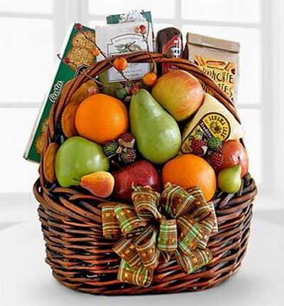Basket of 2 Oranges, 3 red apples, 1 green apple, 2 pears, box of Crackers, bag of Pretzels, Dried fruit snacks, Sausage stick 150g and biscuts.