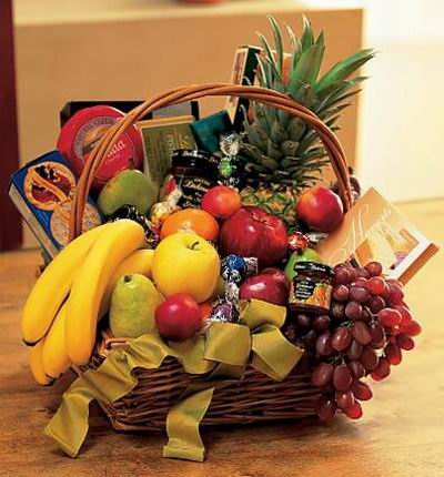 Fruit Basket of a Pineapple, Globe grapes, 3 Bananas, 2 red Apples, 1 Fuji yellow apple, 3 peaches, 2 pears, box of Crackers, Cheese and Strawberry Jam.