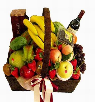 Fruit Basket with 1 bottle of red Wine, Globe Grapes, 1 Watermelon, 8 Bananas, 8 Strawberries, 3 red Apples, 1 yellow Fuji Apple, 3 Star Fruits, 1 Mango, 2 Kiwis and melon.
