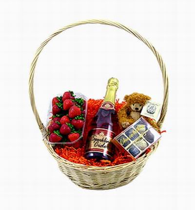 Fruit Basket of Sparkling Cider, 12 Strawberries, Assorted Chocolates an a 15 cm Teddy Bear. Sparkling Cider based on local selection. Brands will vary.  (Photo image is only an example)
