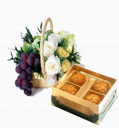 A box of Standard Mooncakes in a fruit and flower basket of 3 cream Roses, 3 yellow Roses, purple Grapes, and baby's breath