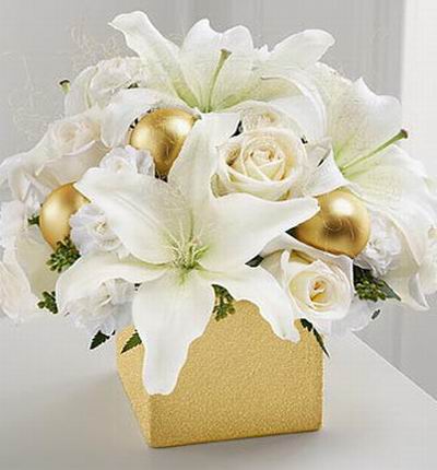 4 Roses, 3 Asiatic lilies and 10 miniature carnations, 3 Golden Ball Decoration,with seeded eucalyptus in gold box.