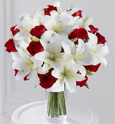 13 Red roses,  12 white Oriental lilies.