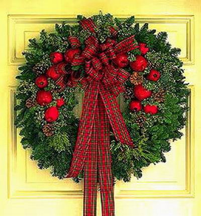 Christmas Flower Selection - Christmas wreath with red apples decoration.  (If apple decorations are not available, other decoration will be used). Artificial and plastic materials are used.
