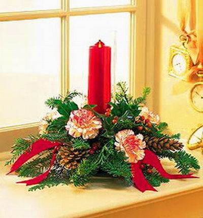 Christmas Flower Selection - Carnations, hypericum berries, and greens with candle table setting