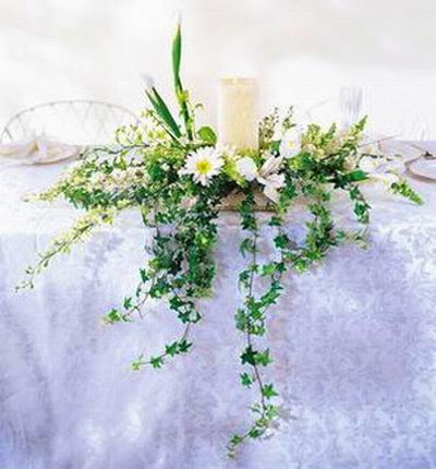 White Chrysanthemum, ivy and white candle mix display