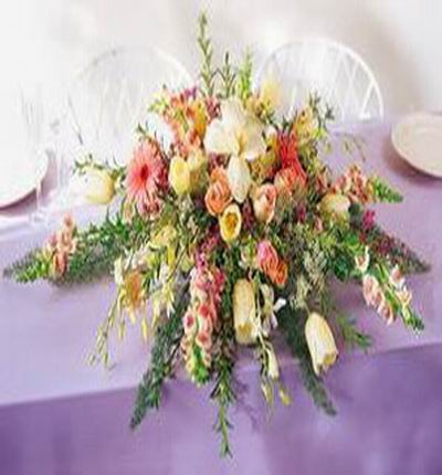 6 white Tulips, 1 white Lily bud, 6 off-shade pink Roses, 3 yellow Roses, Stocks and ivy mix display