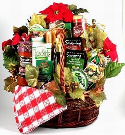 Basket of Cheese Sticks, two Cheese round blocks, Rague Spagetti Sause, Dried Pasta, two boxes of Seasoning, small bottle of Olive Oil, Crackers and canned Beans.