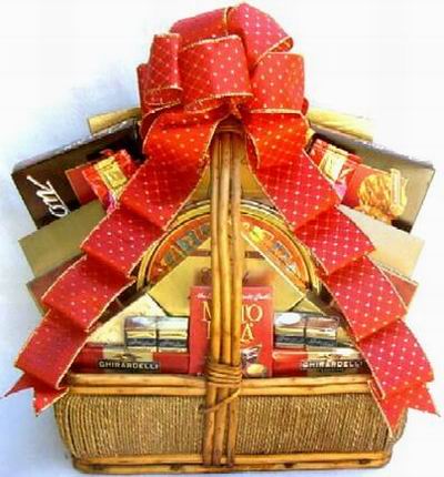 A basket of Ghirardelli Square chocolates, Cheese, Crackers, Assorted Chocolates.