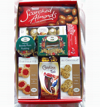 A box of Tart Cookies Chocolate Chip Cookies, Almond Milk Chocolates, Ferrero Rochers - 5pcs, Lindor Sweet Candies, Brady Plum Pudding and Macadamia Gourmet Cake. A substitution of Chocolate Pudding and Chocolate Cake will be made if the Brandy Plum and M