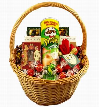 A basket of Sour Cream & Onion Pringles, Tartlette Cookies, Au Chocolat Chocolate Cookies, A bag of sweet Candy Beans surrounded by an assorted Candy mix.