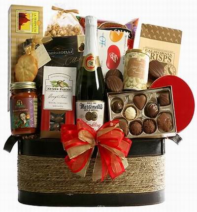 A basket of Sparkling Cider, Assorted Chocolates, Chocolate peanut butter filling, Jelly Bellys, Ghrirardelli Chocolates, Chocolate covered Almonds, Crackers and Salsa.