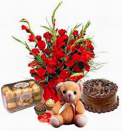 Small Teddy Bear (approx 20 cm) with small box of Ferrero Roches, Gladiolus and Daisies (color may vary) and a chocolate cake