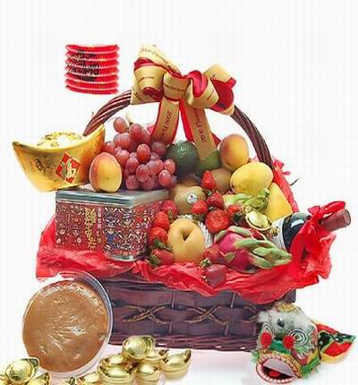Fruit basket of 12 Strawberries 2 Mangos, 1 Pear, 2 Nectarines, 2 Kiwis, Advocado, Green Apple and 2 Dragon Fruits along with a box of cookies and wine.