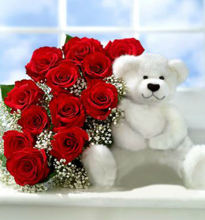 12 red Roses,  Baby Breath in clear crystal plastic wrapping and white bear (color based on availability)