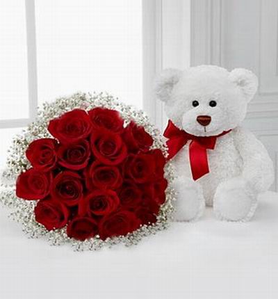 18 red Roses,  Baby Breath in clear crystal plastic wrapping and white bear (color based on availability)