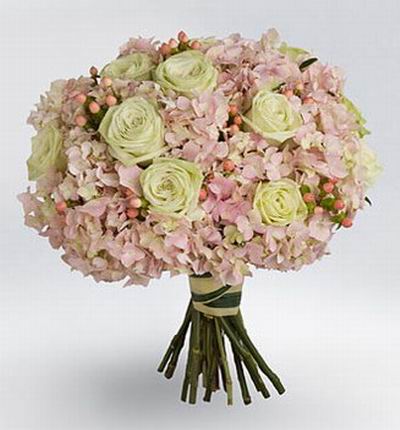 10 white Roses surrounded with pink Hydrangeas.