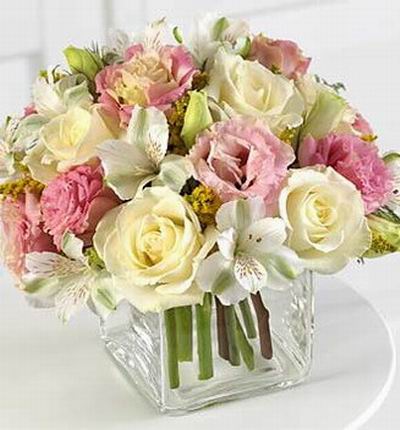 5 white Roses, 6 pink Eustomas, 5 Alstromerias and fillers in vase.