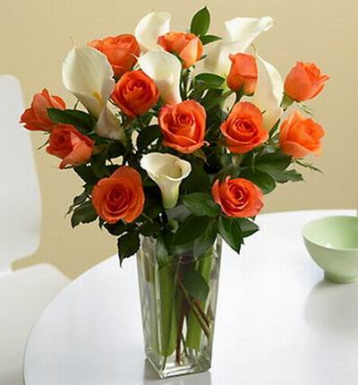 12 Orange roses and 6 Calla lilies