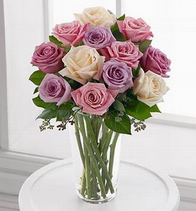 A lavender purple shade combination of light and dark and 3 white roses. A total of 12 roses.