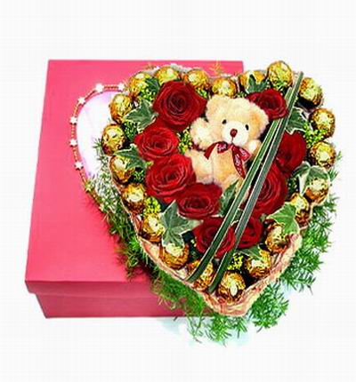 9 roses and 21 Ferrero Chocolate Balls with a mini sized 10cm teddy bear and green fillers.