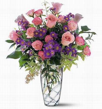 6 pink Roses, 11 pink Carnations, asters and green fillers.