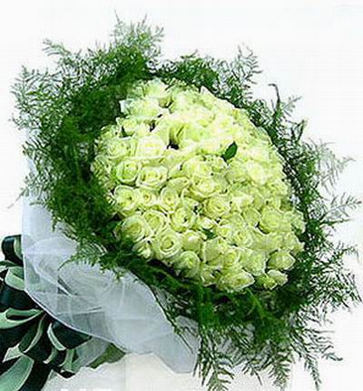 88 white Roses surrounded by greenery.
