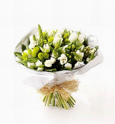 15 white Tulips and greenery.