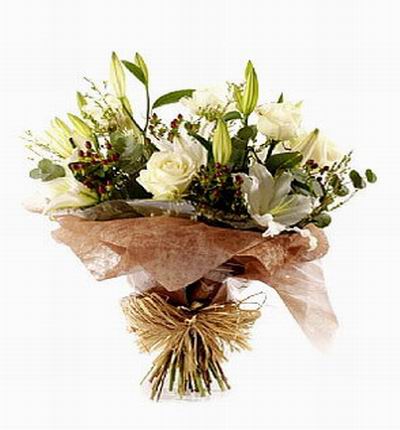 3 white Roses and 3 Lilies surrounded by greenery