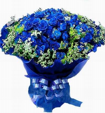 36 blue Roses with greenery.