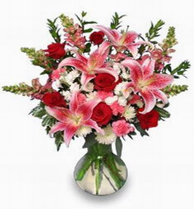 6 red Roses, 4 pink Lilies, 3 white Chrysanthemums, Shasta Daisy and green fillers.