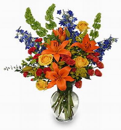 4 orange Lily buds, 8 red Roses, 8 red Carnations, 4 yellow roses, Baptisia and fillers.
