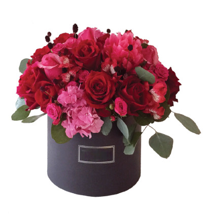 Floral mix in box. Includes 8 red roses, hydrangeas, alstromerias and fillers.  If boxes are not available, please let us know alternatives.